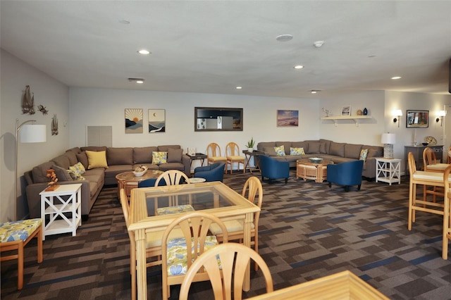 dining space with dark colored carpet