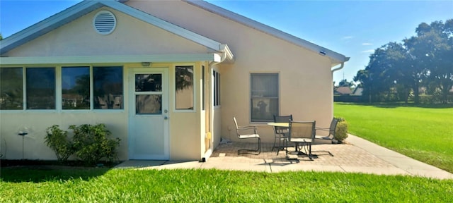 4432 Whitton Way, New Port Richey, FL 34653 - rear view of property with a patio, stucco siding, and a yard