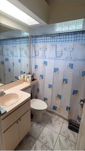 4432 Whitton Way, New Port Richey, FL 34653 - bathroom with marble look tiles and vanity