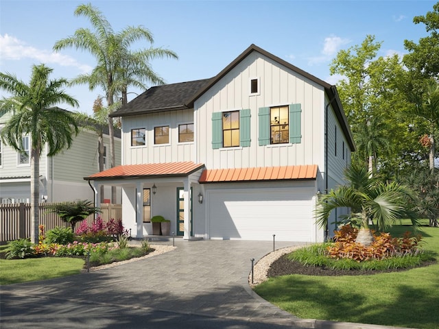 modern inspired farmhouse featuring a garage and a front lawn