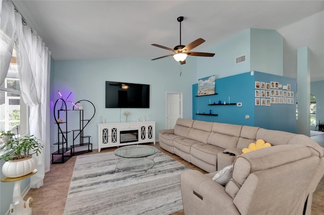 living room with vaulted ceiling and ceiling fan