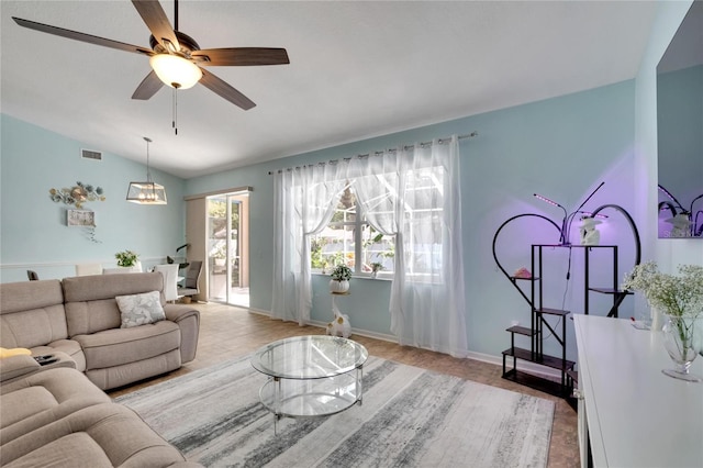 living room with vaulted ceiling, ceiling fan, and light hardwood / wood-style floors