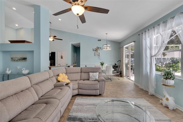 living room with high vaulted ceiling and ceiling fan