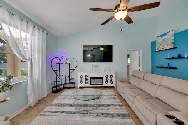 living room with lofted ceiling and ceiling fan