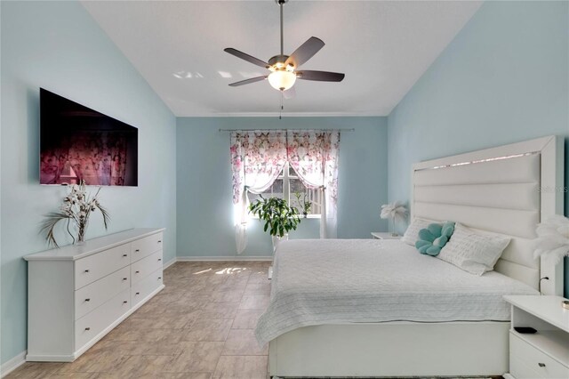 bedroom with lofted ceiling and ceiling fan