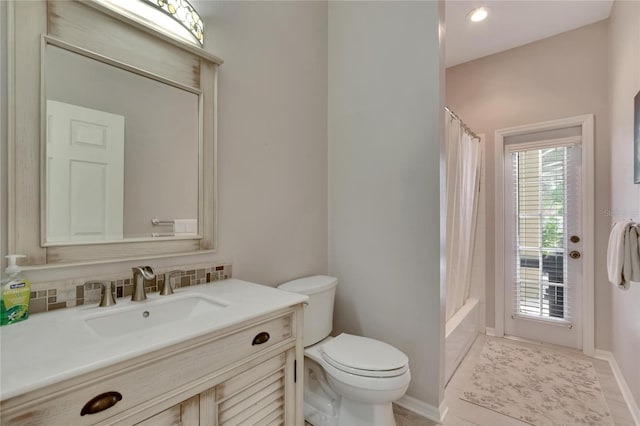 full bathroom with tasteful backsplash, vanity, shower / bath combo, tile patterned flooring, and toilet