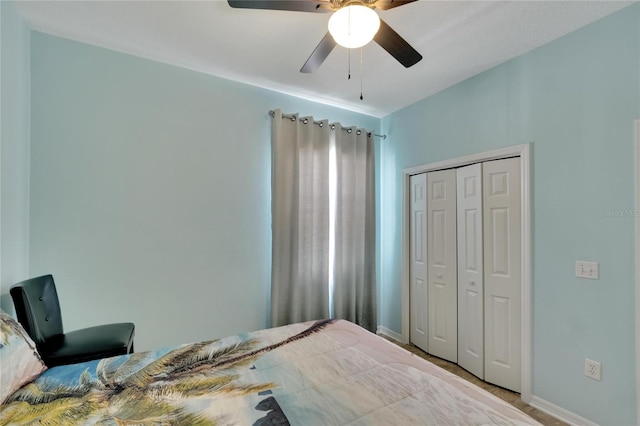 bedroom featuring ceiling fan and a closet