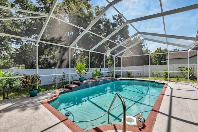 view of pool featuring a lanai and a patio area