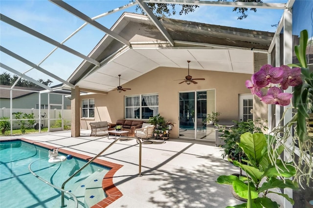 back of house featuring a lanai, an outdoor hangout area, ceiling fan, and a patio area