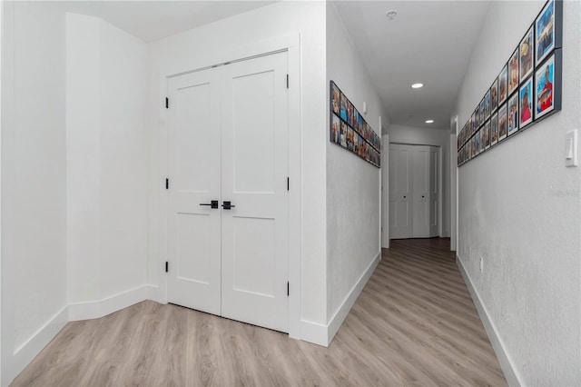 corridor featuring light hardwood / wood-style floors