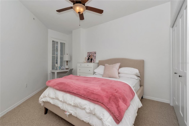 carpeted bedroom with a closet and ceiling fan