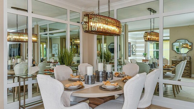 dining space with ornamental molding