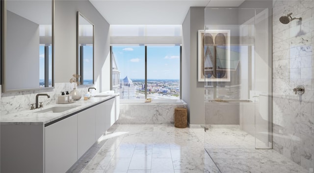 bathroom with vanity and shower with separate bathtub