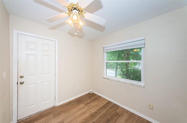 unfurnished room featuring ceiling fan and hardwood / wood-style floors