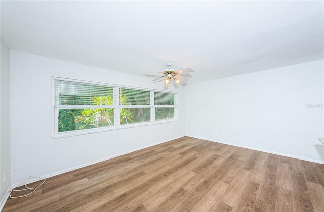 empty room with light hardwood / wood-style floors and ceiling fan