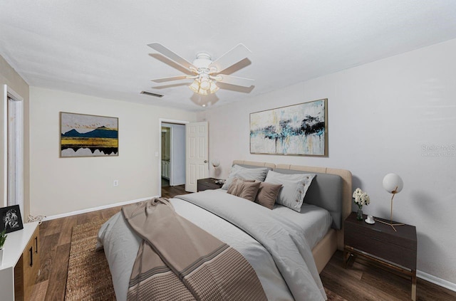 bedroom with ceiling fan and dark wood-type flooring