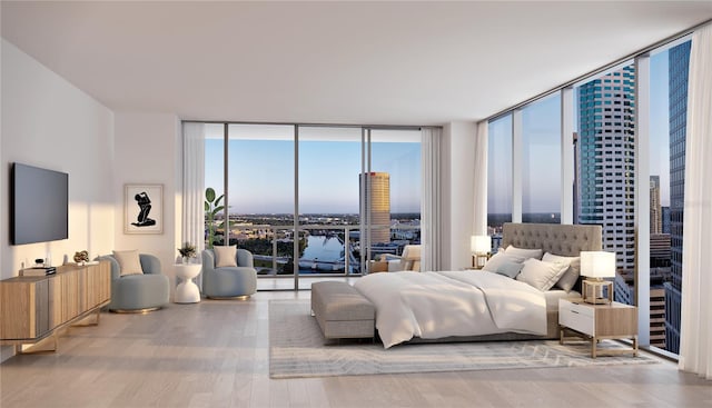 bedroom with hardwood / wood-style flooring, a wall of windows, and access to exterior