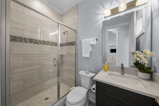 bathroom featuring vanity, toilet, and a shower with shower door