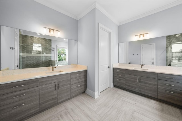 bathroom featuring crown molding, vanity, and an enclosed shower