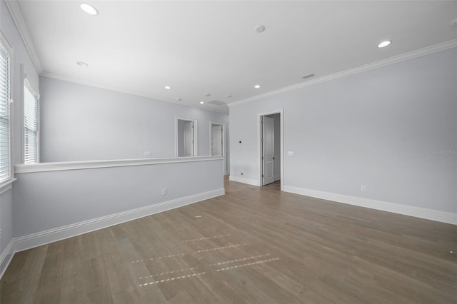 unfurnished room with hardwood / wood-style flooring and ornamental molding