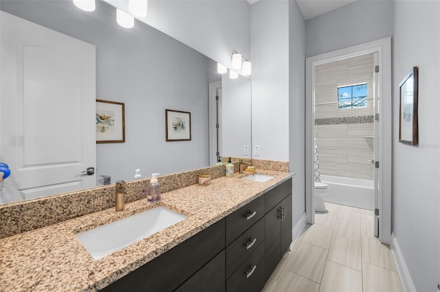 full bathroom with tiled shower / bath combo, vanity, and toilet