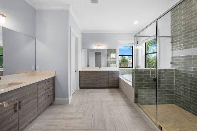 bathroom with parquet flooring, ornamental molding, plus walk in shower, and vanity