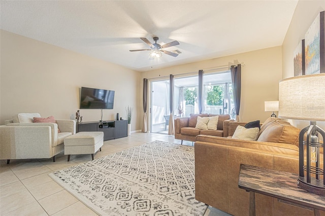 tiled living room featuring ceiling fan