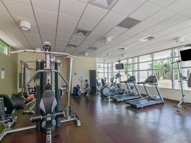 gym featuring a paneled ceiling