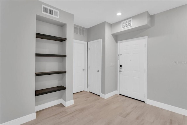 unfurnished bedroom with light wood-type flooring