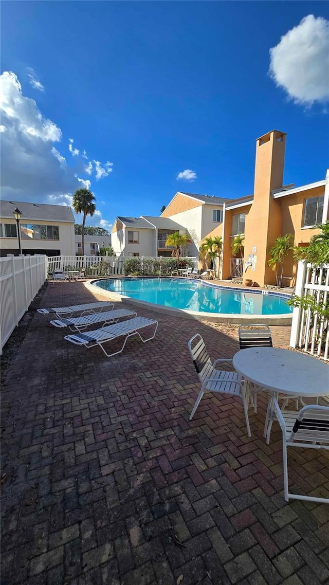 view of pool featuring a patio area