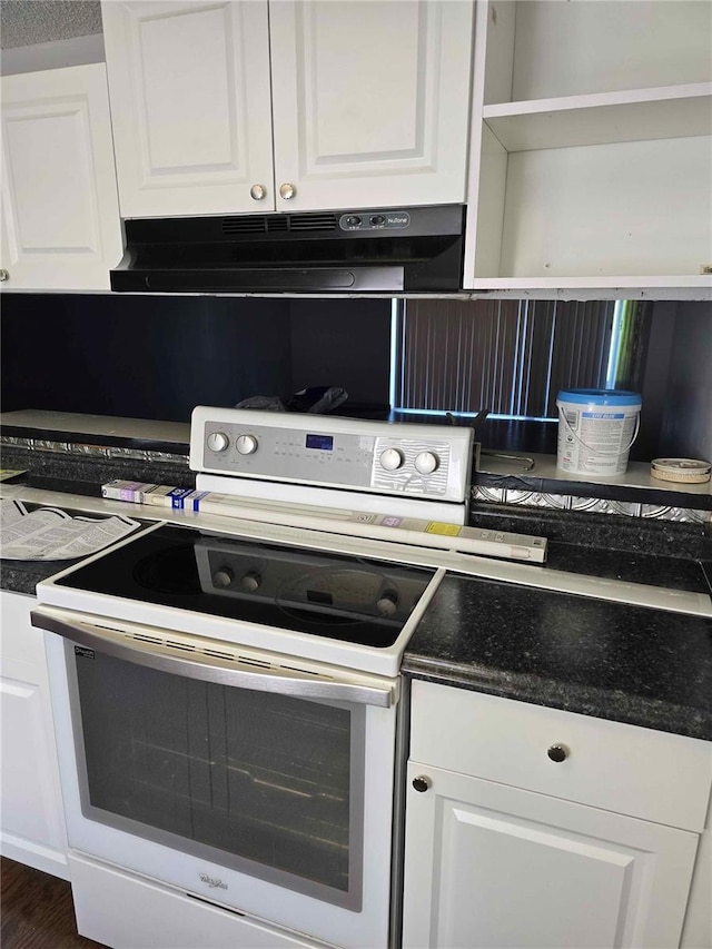 kitchen featuring white cabinetry, white range with electric cooktop, and exhaust hood