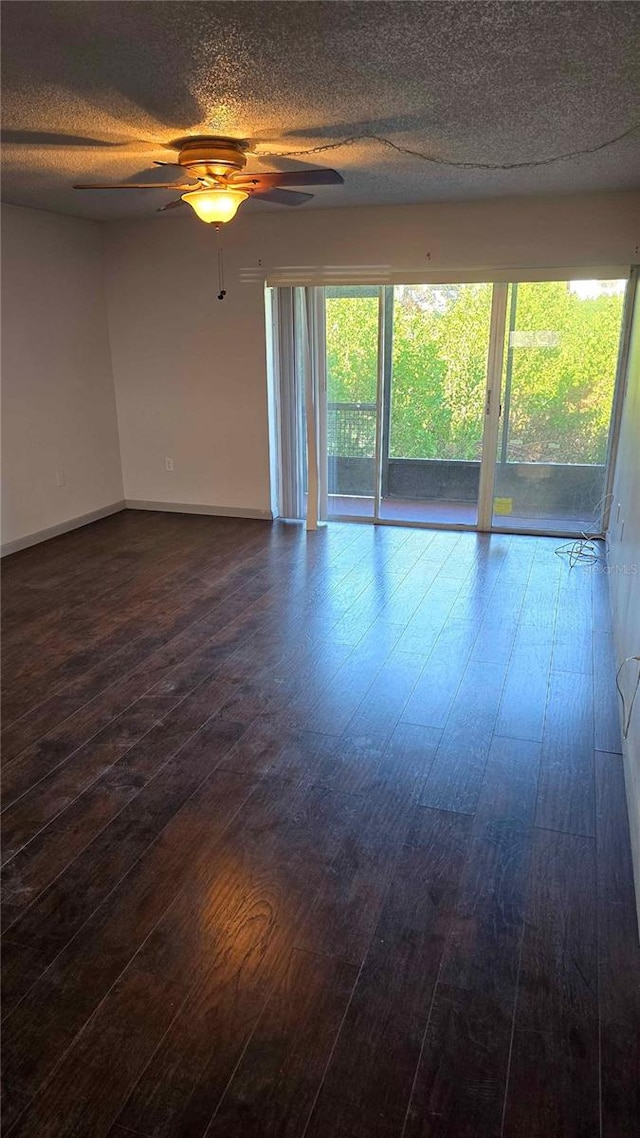 empty room featuring wood-type flooring, a textured ceiling, and ceiling fan