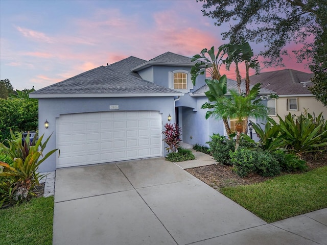 view of front of home with a garage