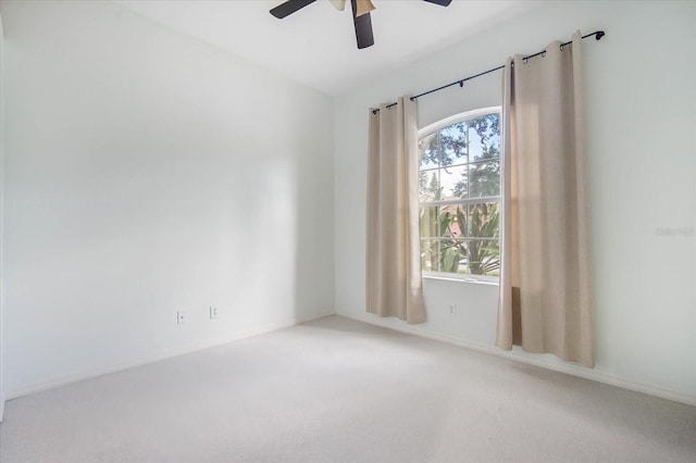 empty room featuring ceiling fan and carpet floors