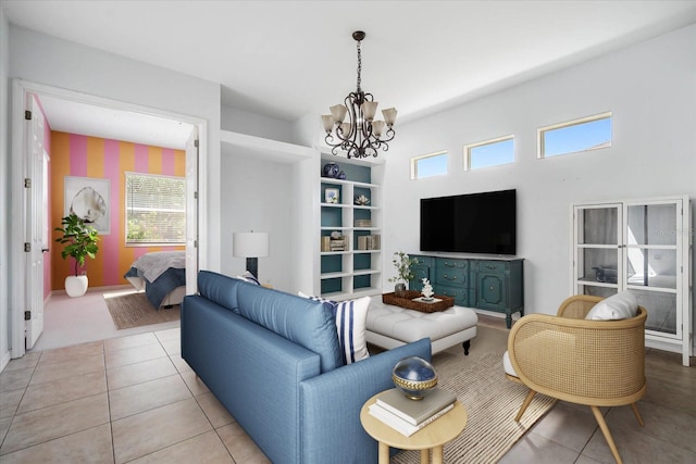 tiled living room with a notable chandelier and a healthy amount of sunlight