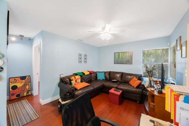 living room with hardwood / wood-style floors and ceiling fan