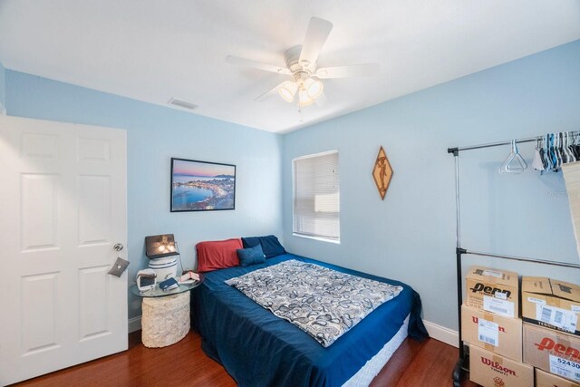 bedroom featuring ceiling fan and dark hardwood / wood-style flooring