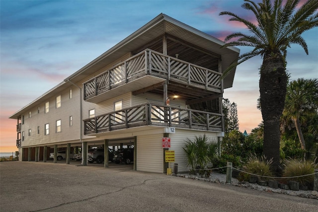 view of outdoor building at dusk