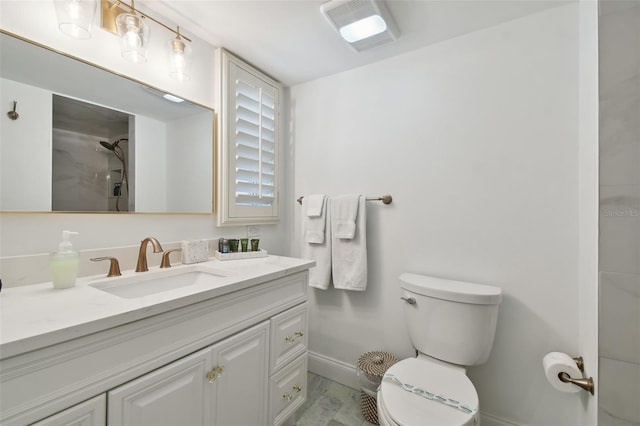 bathroom featuring vanity, a shower, and toilet