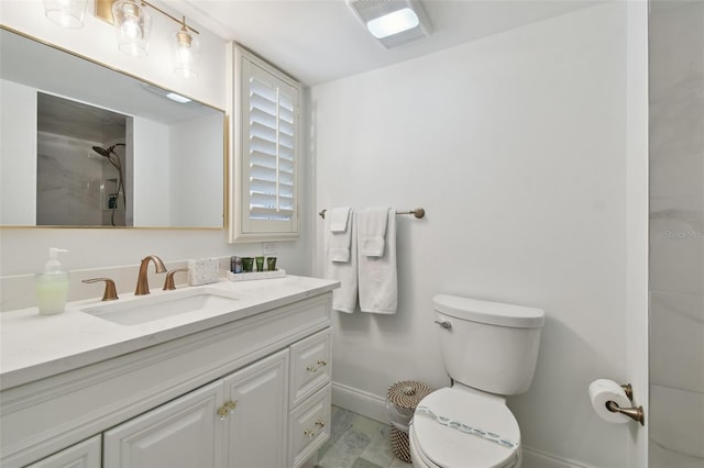 bathroom with walk in shower, vanity, and toilet