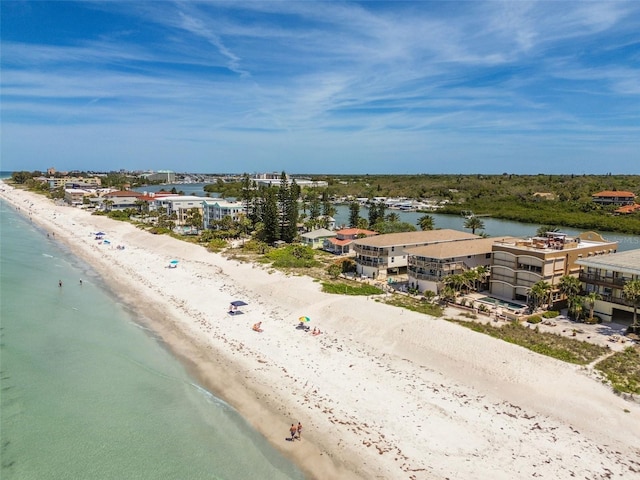 birds eye view of property featuring a view of the beach and a water view