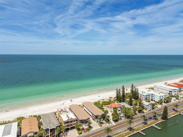 drone / aerial view with a water view and a beach view