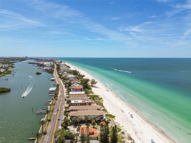 birds eye view of property with a view of the beach and a water view