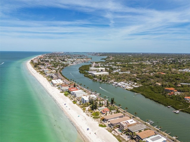 birds eye view of property featuring a water view and a beach view