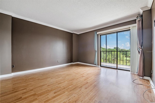 unfurnished room with light hardwood / wood-style floors, crown molding, and a textured ceiling