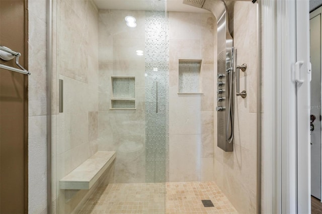 bathroom featuring an enclosed shower