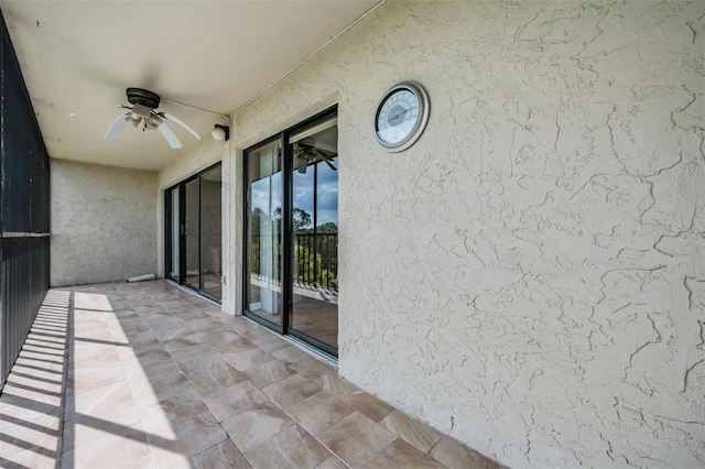 exterior space with ceiling fan