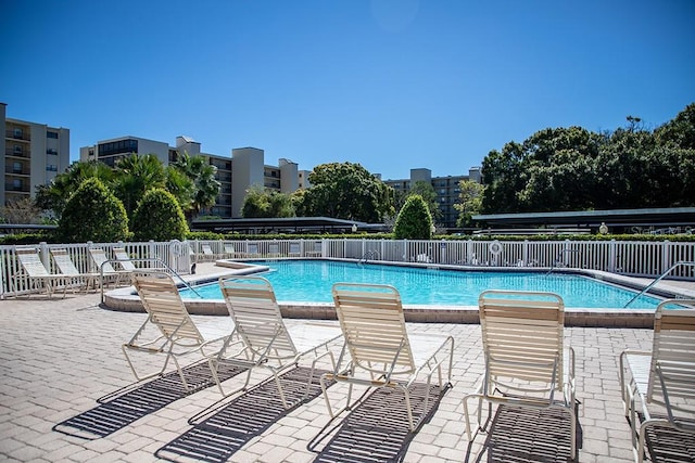 view of swimming pool with a patio