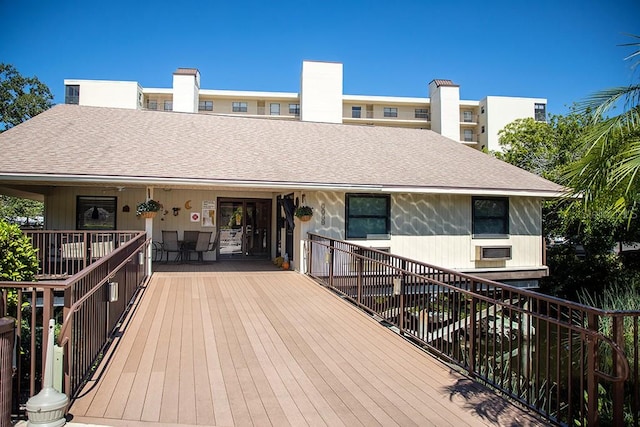 back of house featuring a deck