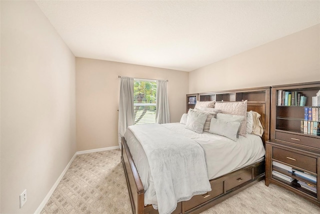 bedroom with light colored carpet